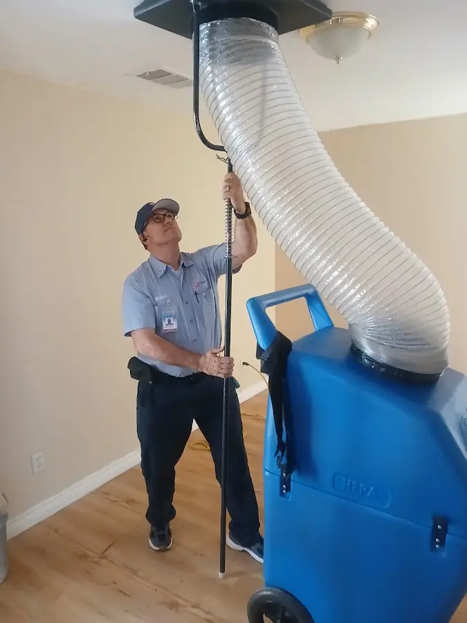 Furnace Tune-Up technician using HEPA equipment in Savannah